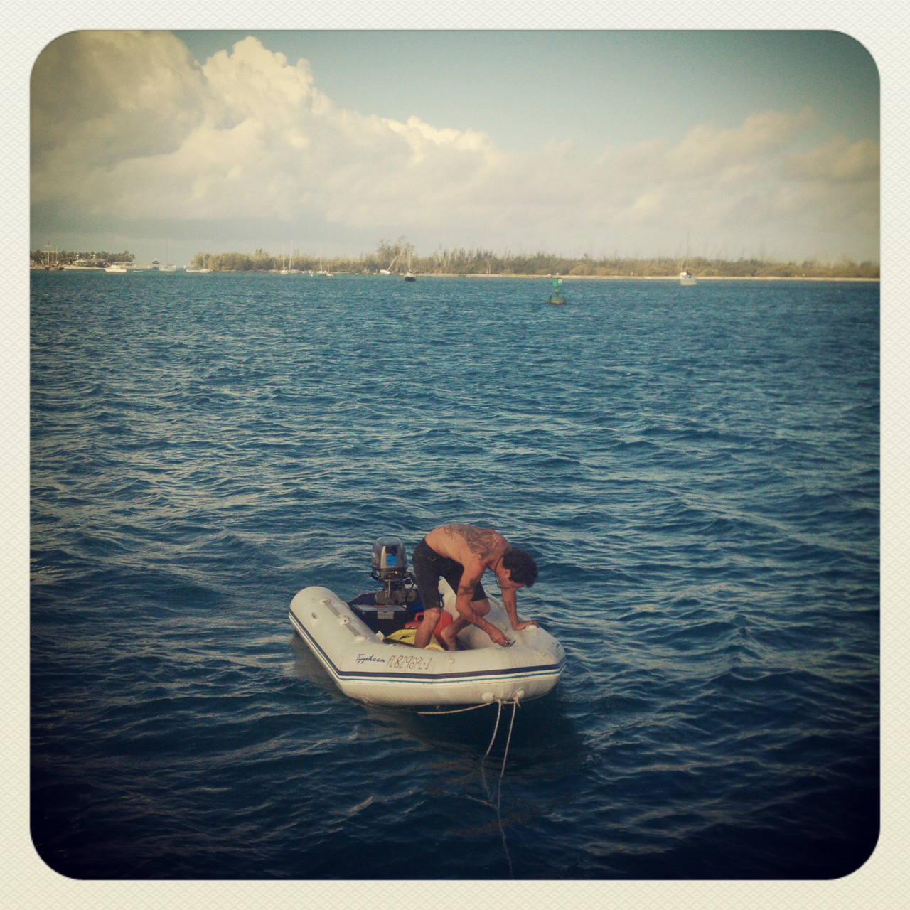 Tyler pumping up his dinghy._04-18-2013_014.jpg
