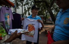 00578-2906730-Vendor_sale_the_Pope_Francis_t_shirts_at_Rizal_Park_in_Manila_ci-a-9_1421224809256.jpg