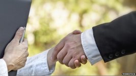 _75040961_capitalismhandshake.jpg